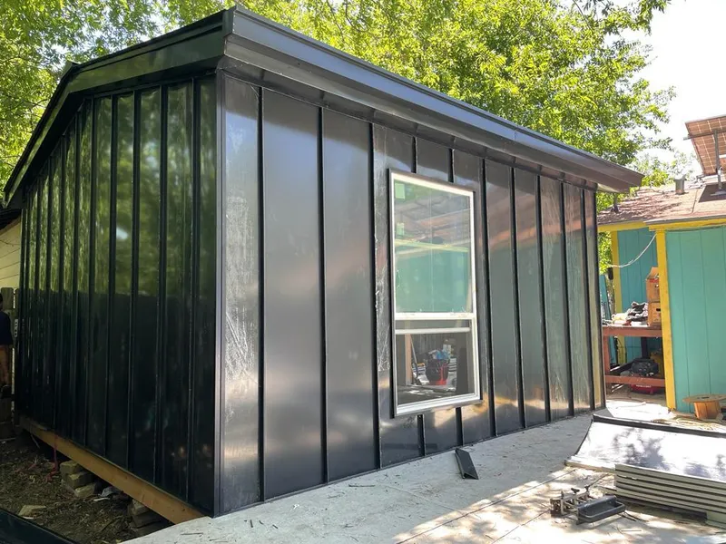 Black standing seam metal wall panels for Roof Inspection in West Seneca